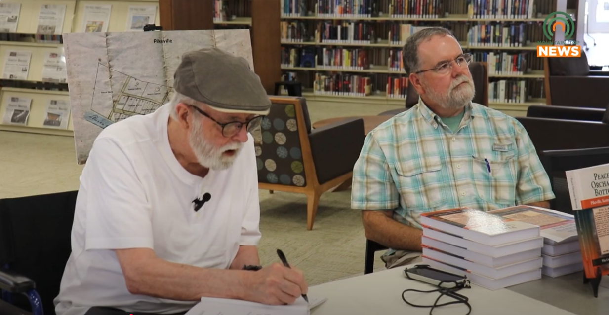 Authors of Peach Orchard Bottom sign books at Pike County Library
